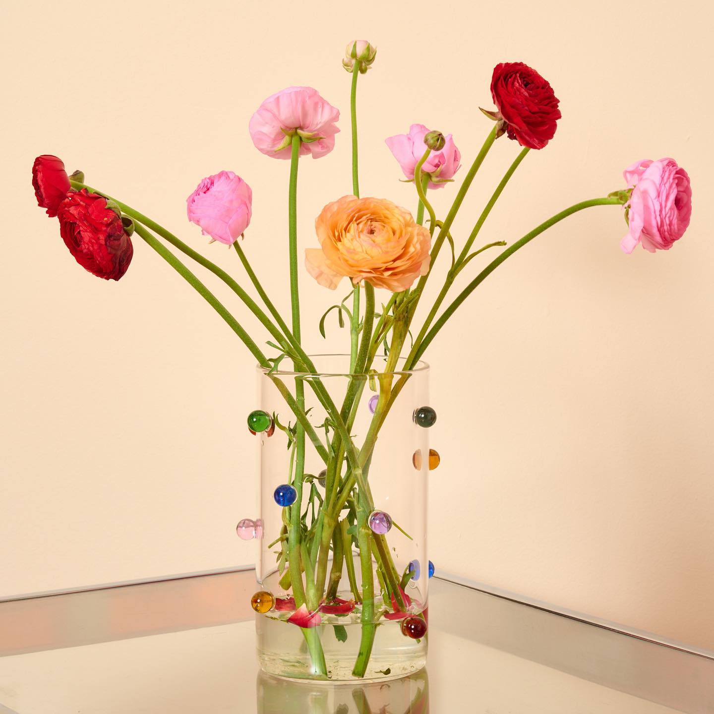 Image by @comingsoonny featuring our Pomponette Vase filled with ranunculus flowers.