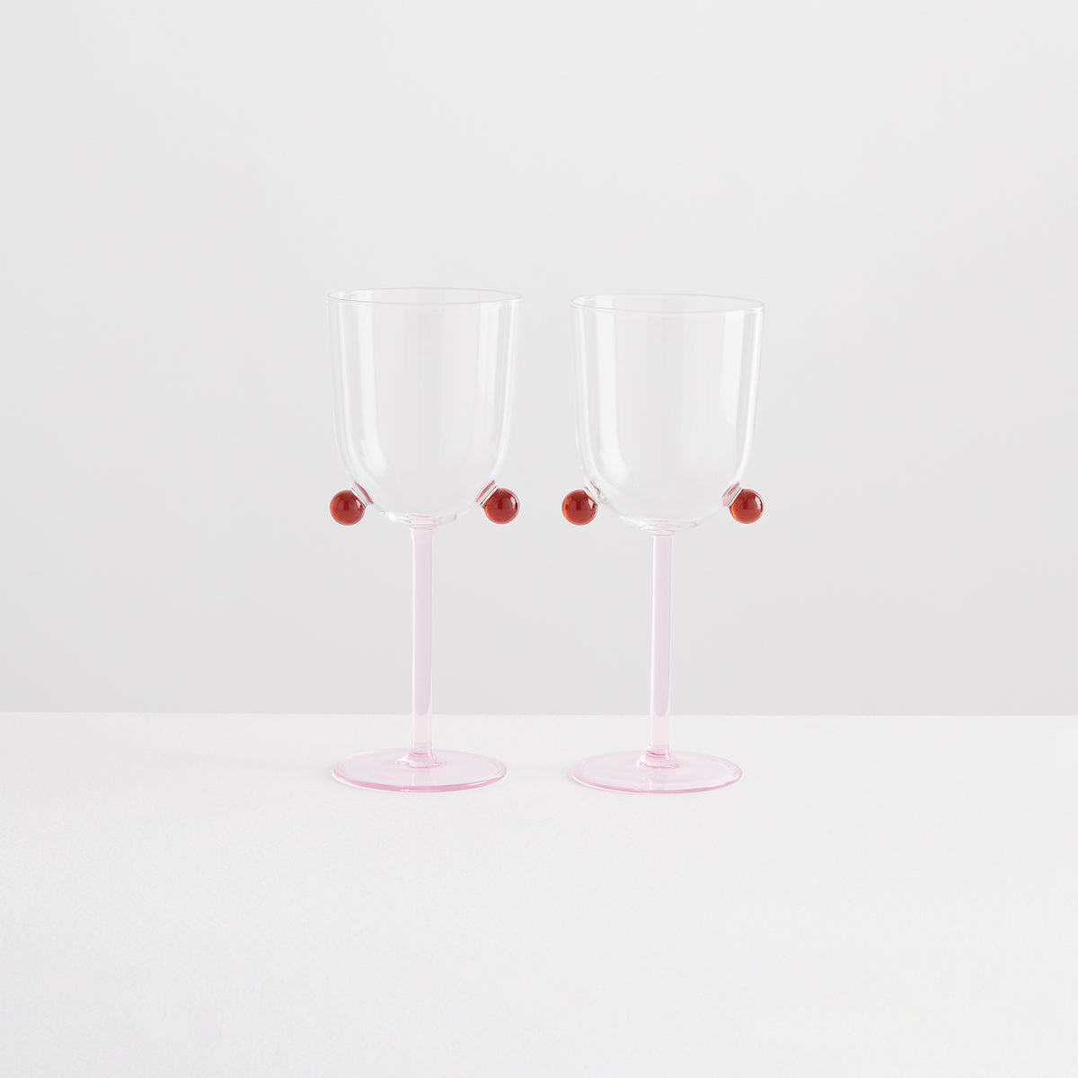 Maison Balzac 2 POMPOM WINE GLASSES | PINK & AMBER